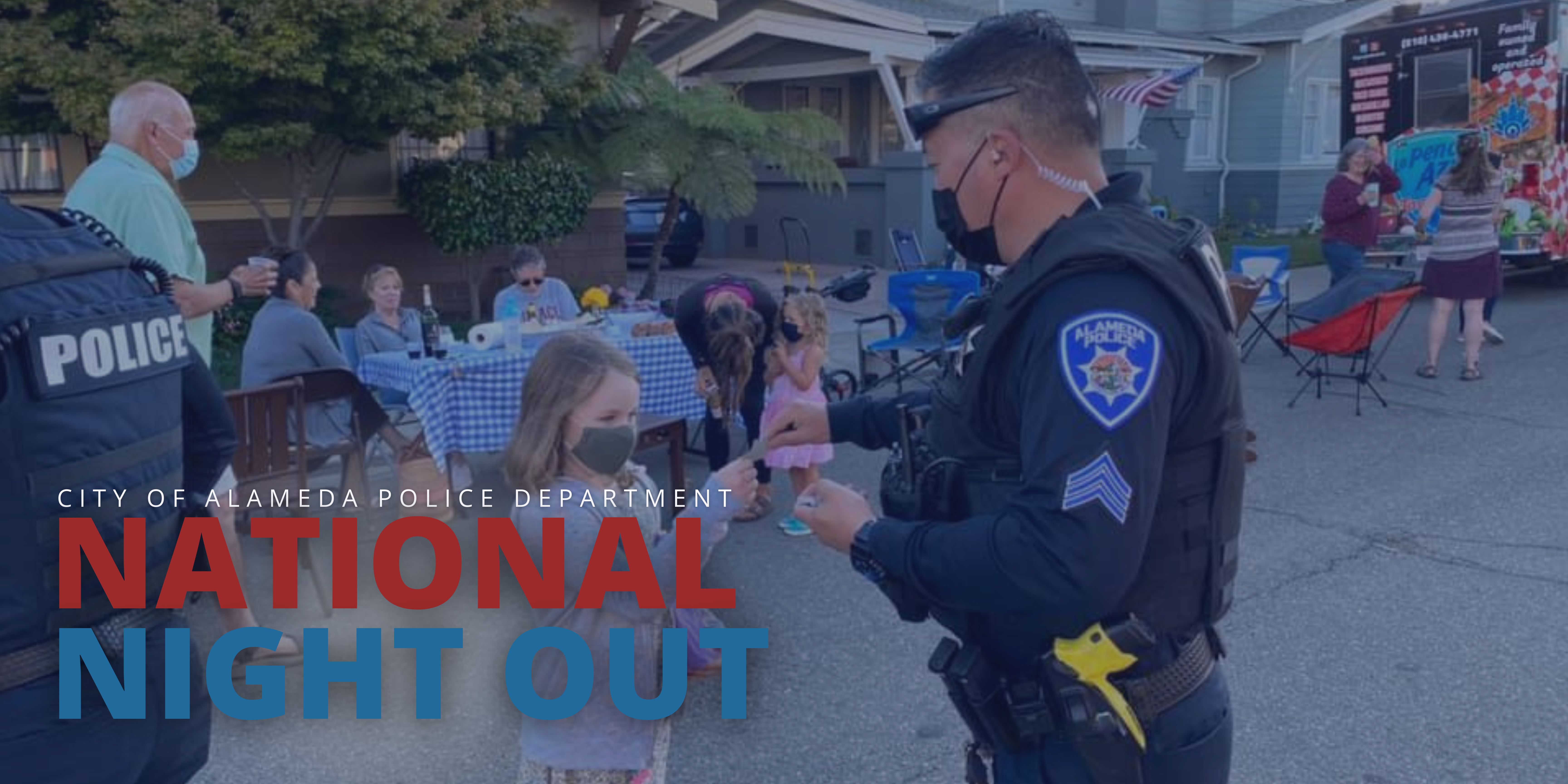 Picture of an officer at a community block party for National Night Out